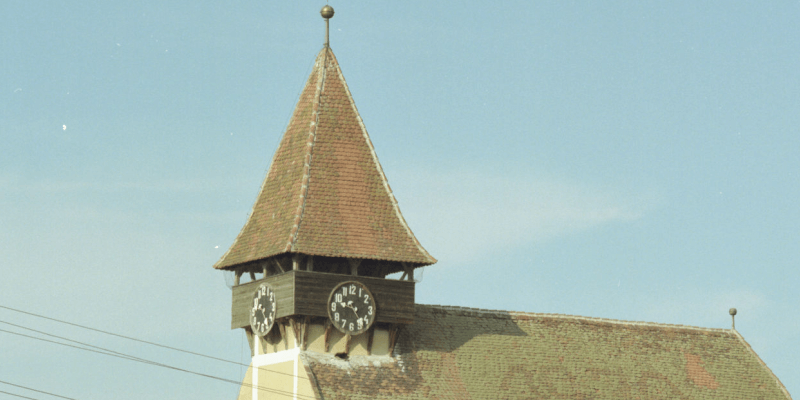 Bell tower and tower clock of the fortified church in Reussmarkt/Miercurea Sibiului in Transylvania