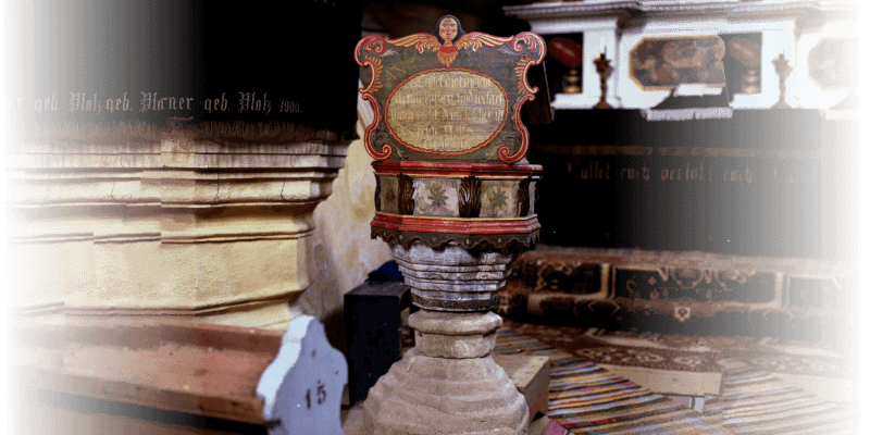 The baptismal font of the fortified church in Cloasterf in Transylvania